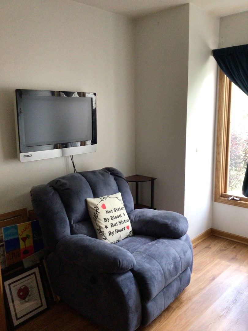 18690 Forest View Lane Lansing, IL 60438 - Photo 26 of 32 a living room with furniture and a flat screen tv