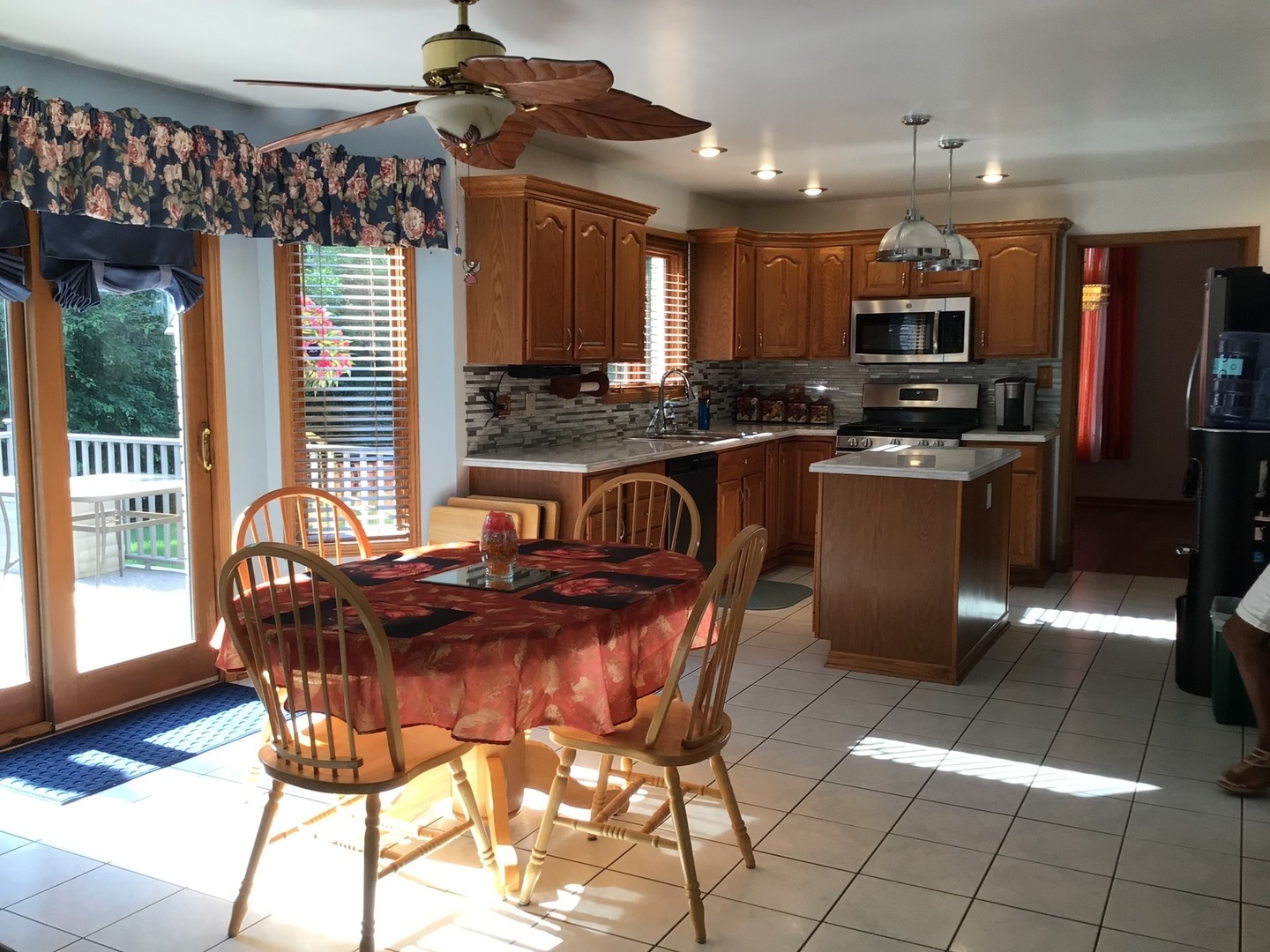 18690 Forest View Lane Lansing, IL 60438 - Photo 9 of 32 a view of a dining room with furniture a chandelier and wooden floor
