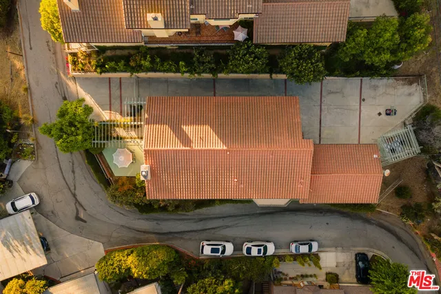 an aerial view of a house with a lake view