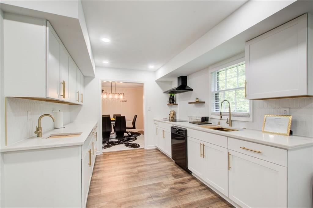 2085 High Point Trail Southwest Atlanta, GA 30331 - Photo 14 of 36 a kitchen with a sink stove and cabinets
