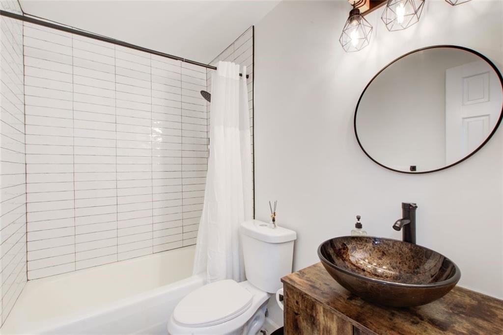 2085 High Point Trail Southwest Atlanta, GA 30331 - Photo 25 of 36 a bathroom with a toilet and a mirror