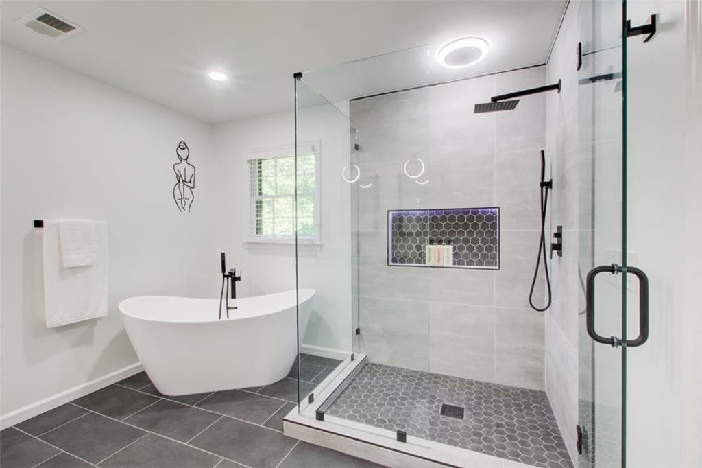 2085 High Point Trail Southwest Atlanta, GA 30331 - Photo 28 of 36 a bathroom with a bathtub and shower