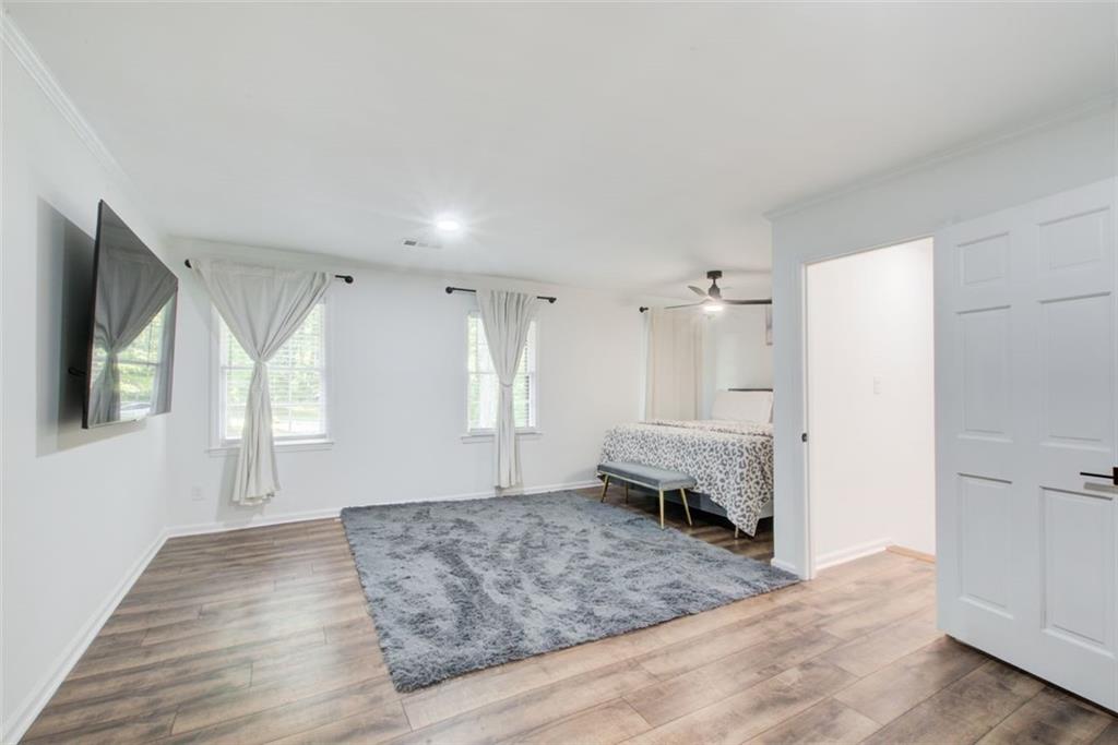 2085 High Point Trail Southwest Atlanta, GA 30331 - Photo 30 of 36 a bedroom with a bed and a couch