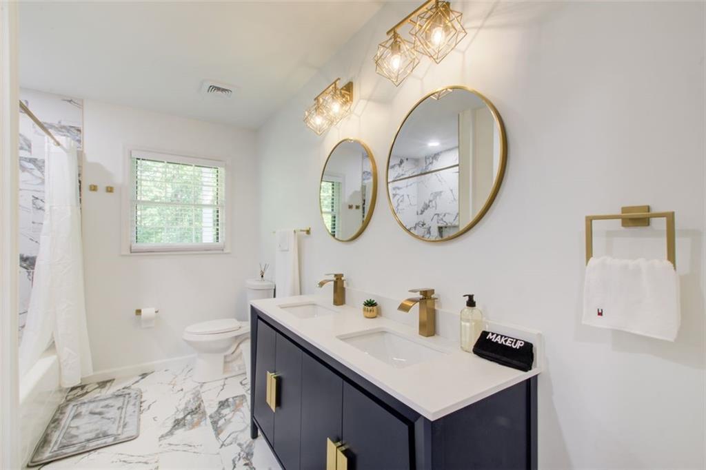 2085 High Point Trail Southwest Atlanta, GA 30331 - Photo 33 of 36 a bathroom with a sink and a mirror