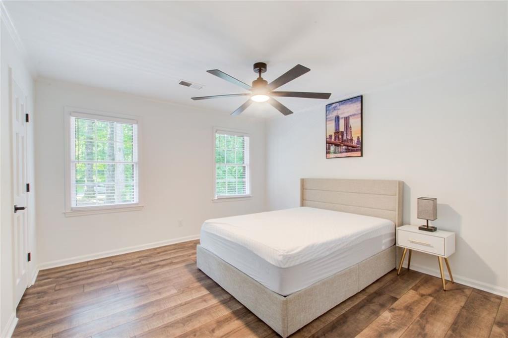 2085 High Point Trail Southwest Atlanta, GA 30331 - Photo 35 of 36 a white bed sitting in a bedroom next to a window