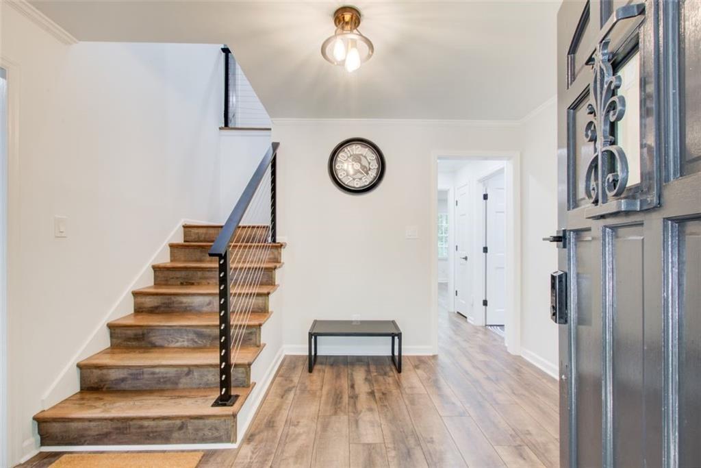 2085 High Point Trail Southwest Atlanta, GA 30331 - Photo 4 of 36 a view of staircase with wooden floor and white walls