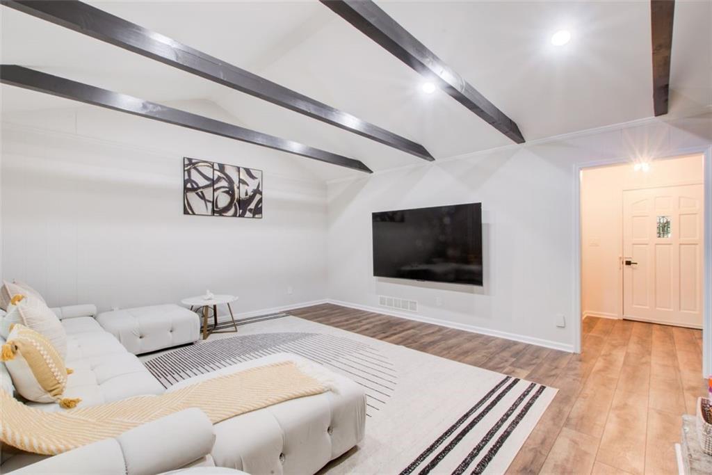 2085 High Point Trail Southwest Atlanta, GA 30331 - Photo 8 of 36 a living room with furniture and a flat screen tv
