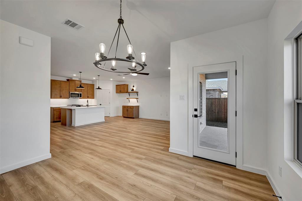 524 Brookside Drive Van Alstyne, TX 75495 - Photo 15 of 32 a view of a kitchen with a sink and dishwasher wooden floor