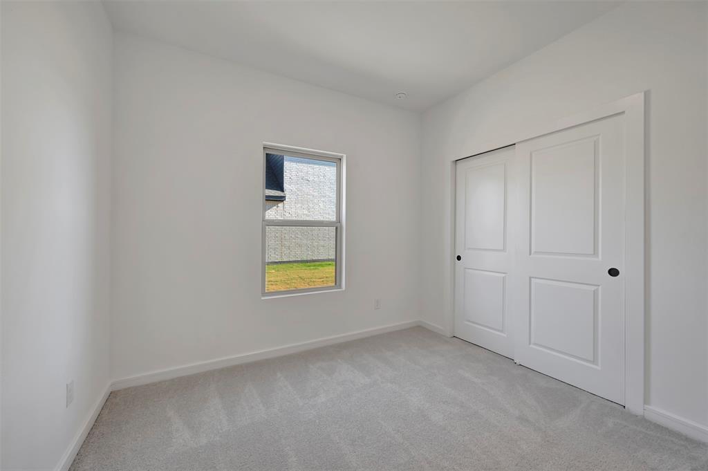 524 Brookside Drive Van Alstyne, TX 75495 - Photo 22 of 32 a view of an empty room and window