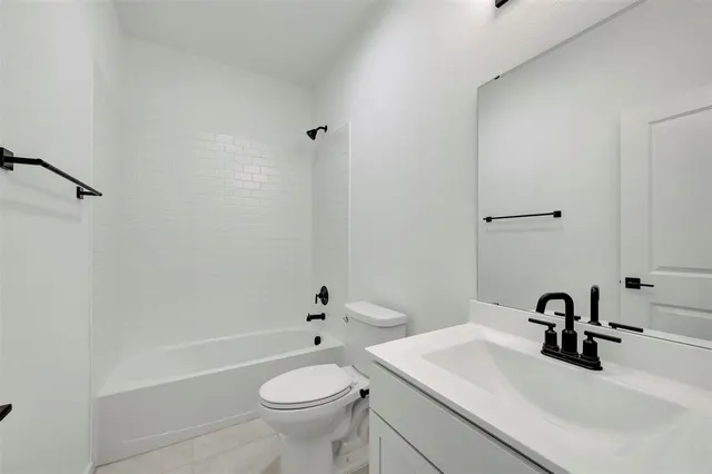 a bathroom with a sink toilet and a bathtub