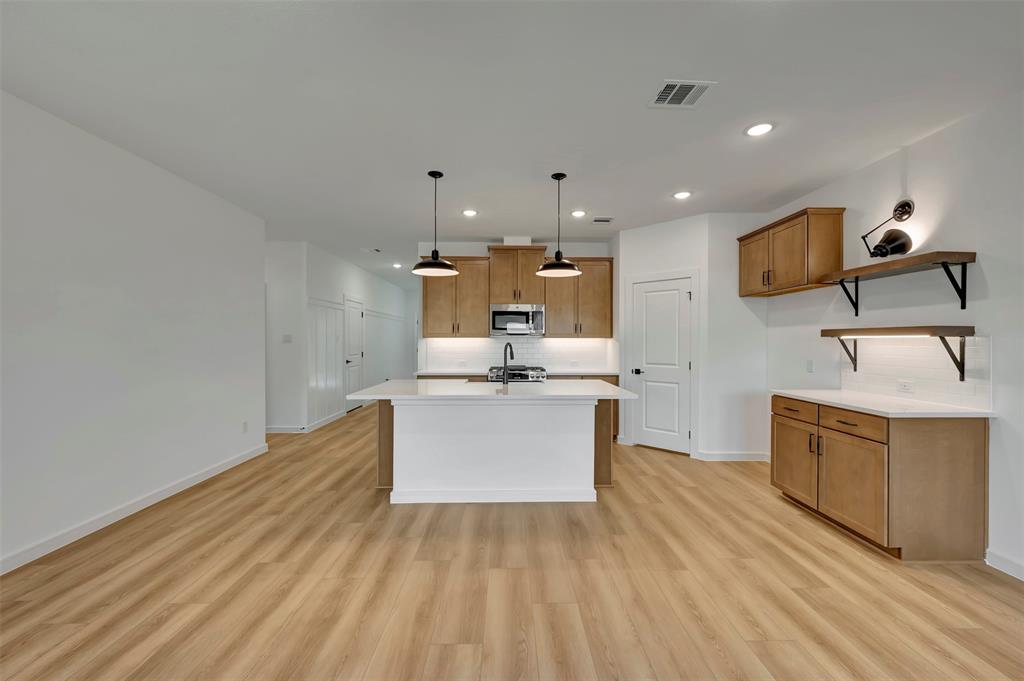 524 Brookside Drive Van Alstyne, TX 75495 - Photo 8 of 32 a view of kitchen with sink microwave and stove
