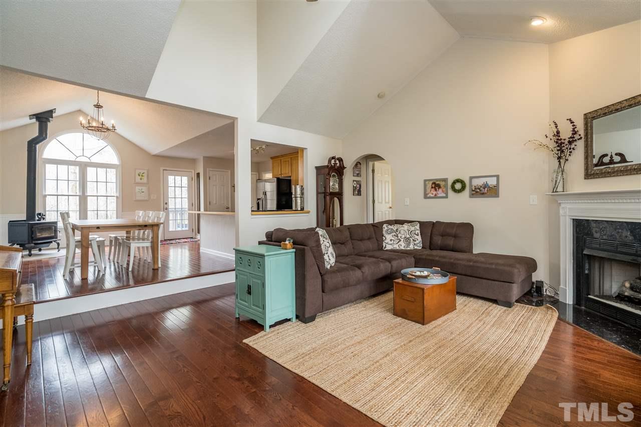 1000 Highlander Drive Raleigh, NC 27603 - Photo 3 of 28 a living room with furniture and a fireplace
