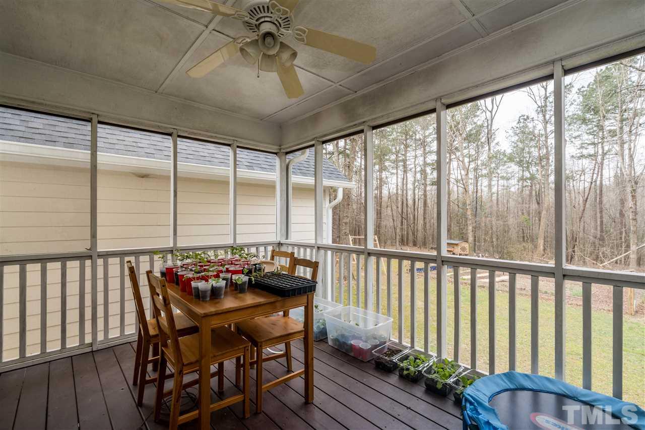 1000 Highlander Drive Raleigh, NC 27603 - Photo 22 of 28 a view of a dining room with furniture window and wooden floor
