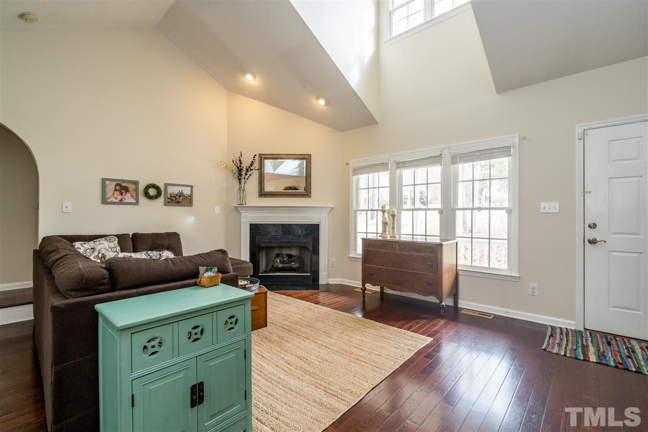 1000 Highlander Drive Raleigh, NC 27603 - Photo 4 of 28 a living room with furniture and a fireplace