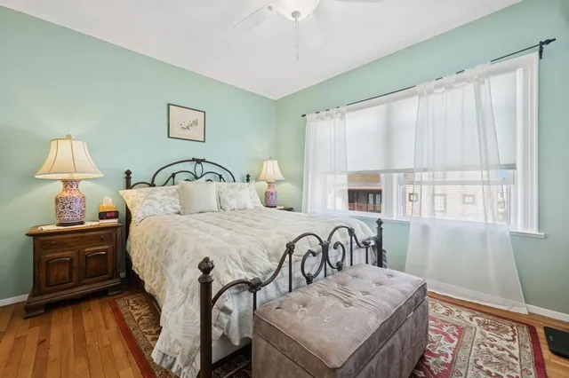 a bedroom with a bed and a table