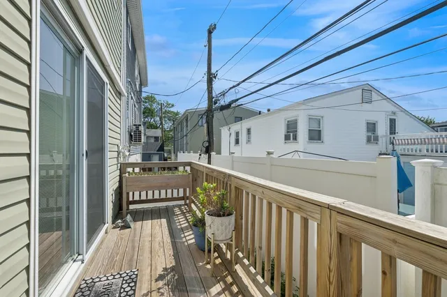 a view of a balcony with car parked