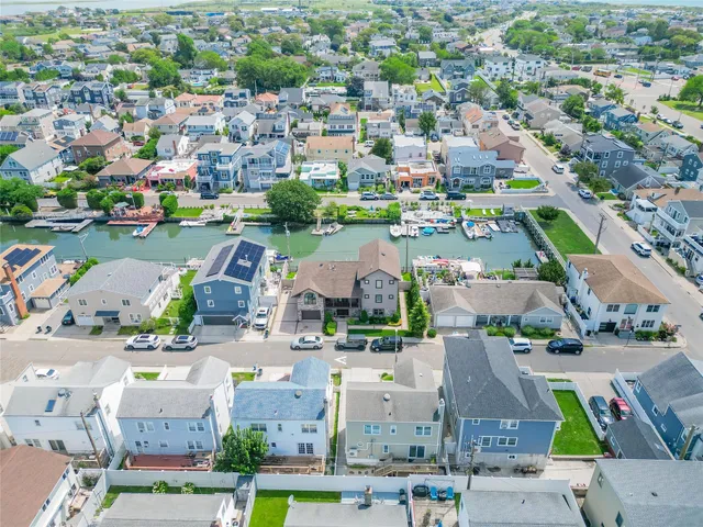 an aerial view of a city with lots of houses