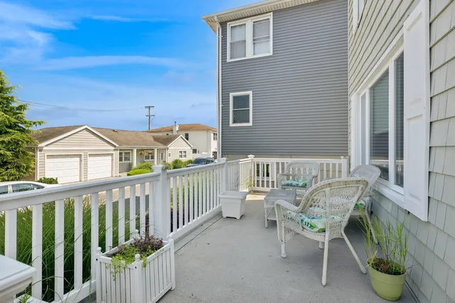 a view of a chair and table in the balcony