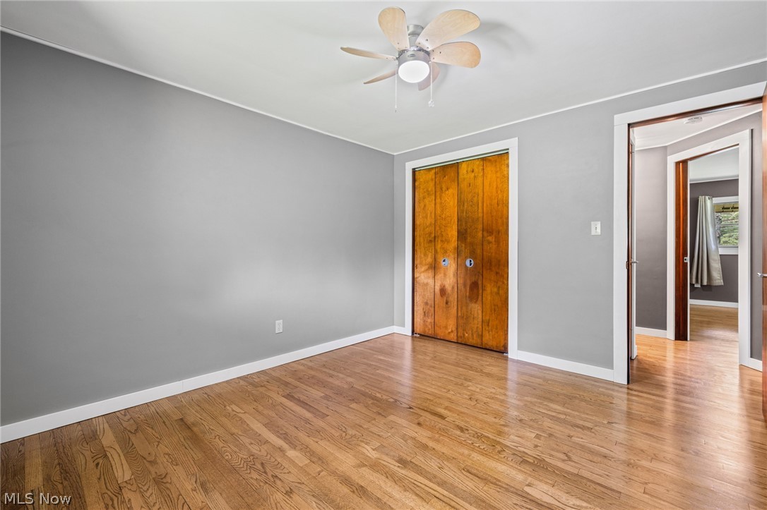 17583 Shurmer Road Strongsville, OH 44136 - Photo 32 of 50 Interior room featuring wood-finish flooring, light gray walls, and white trim