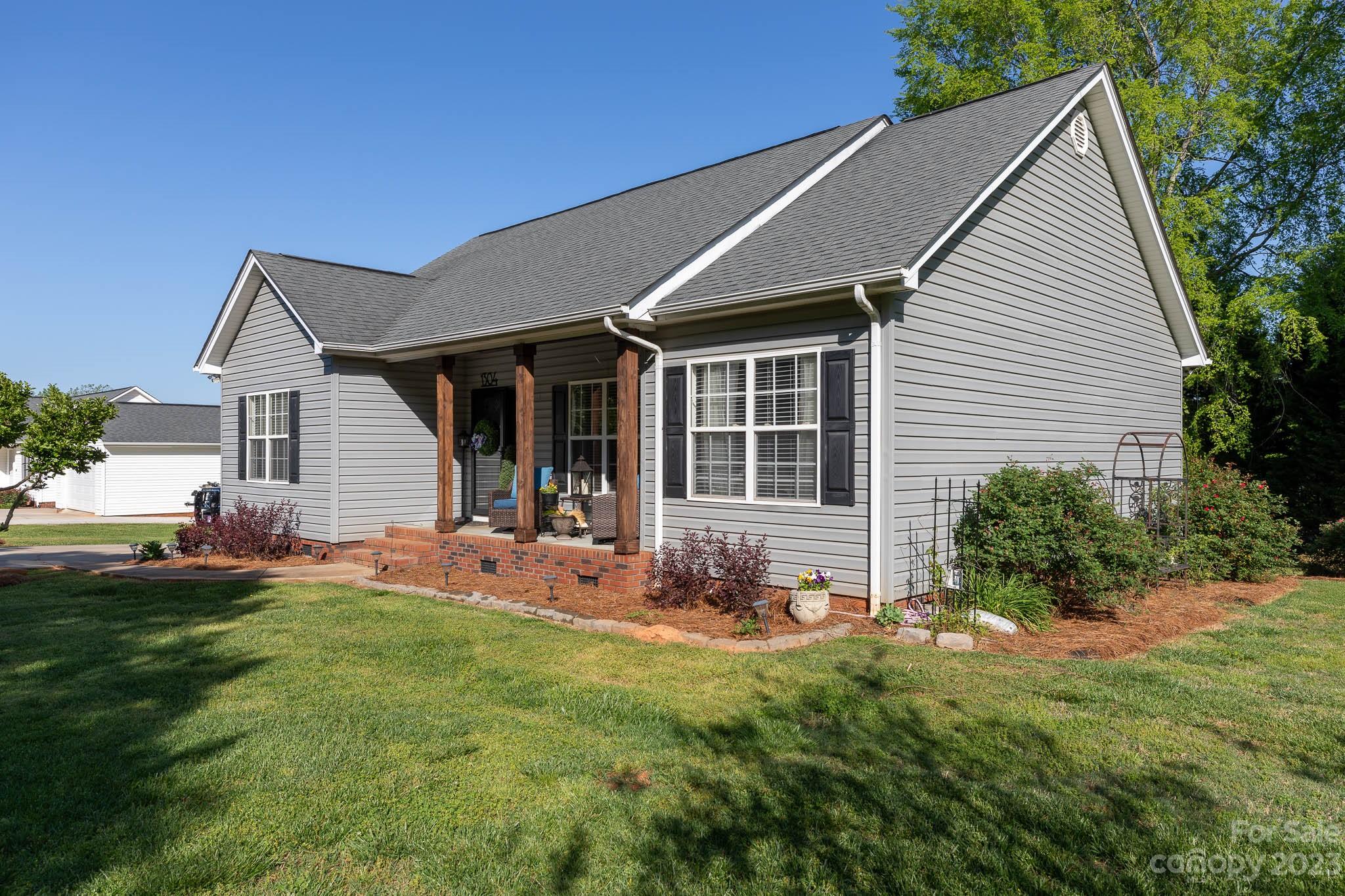 1304 Lawrence Road Clover, SC 29710 - Photo 3 of 30 a front view of house with yard outdoor seating and green space