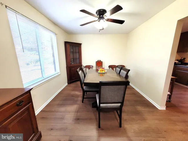 a view of a dining room with furniture and window