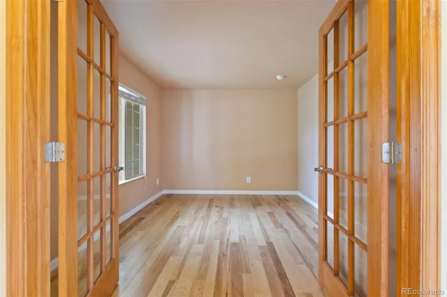 a view of a room with wooden floor and staircase