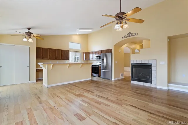 a view of a kitchen with a microwave and a fireplace