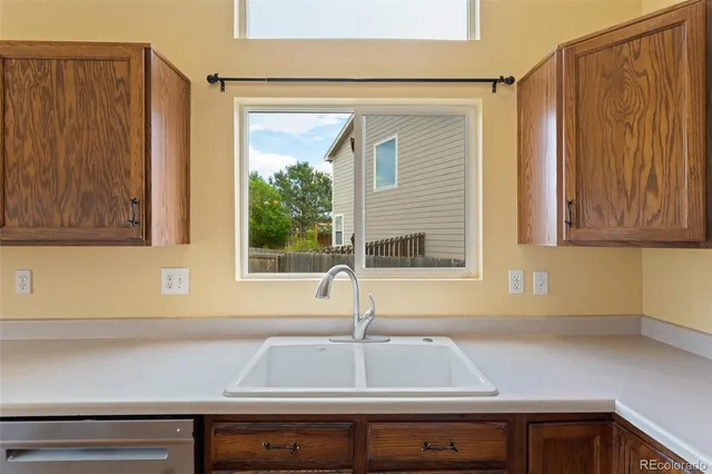 a kitchen with a sink and a window