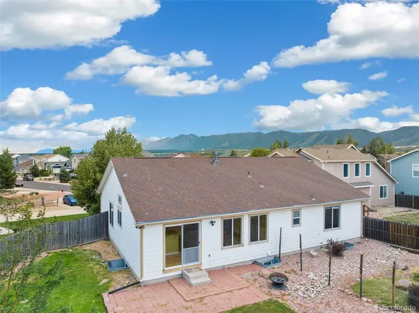 a aerial view of a house with a yard