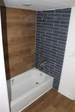 a view of a living room with a fireplace