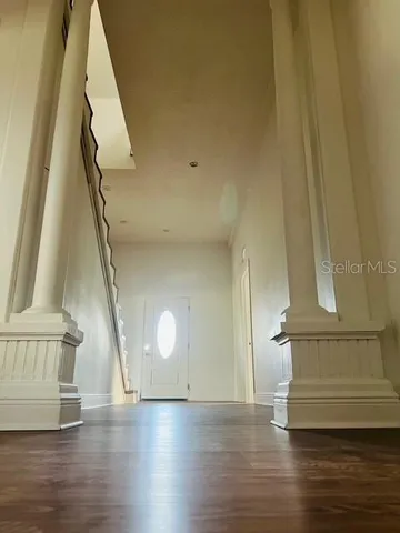 a view of entryway with wooden floor