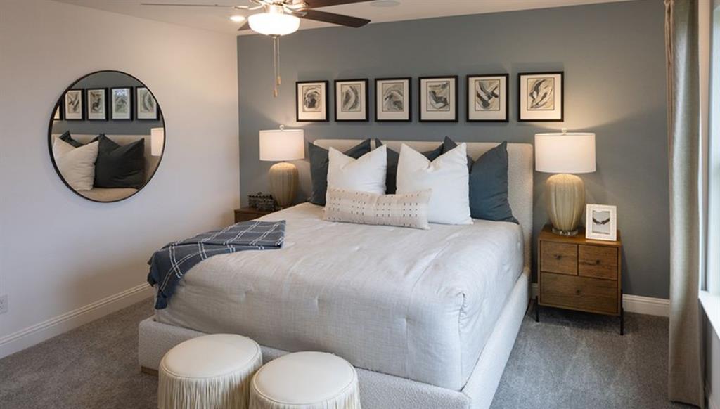 3116 Winecup Road Celina, TX 75009 - Photo 5 of 17 a bedroom with a bed and a painting on the wall