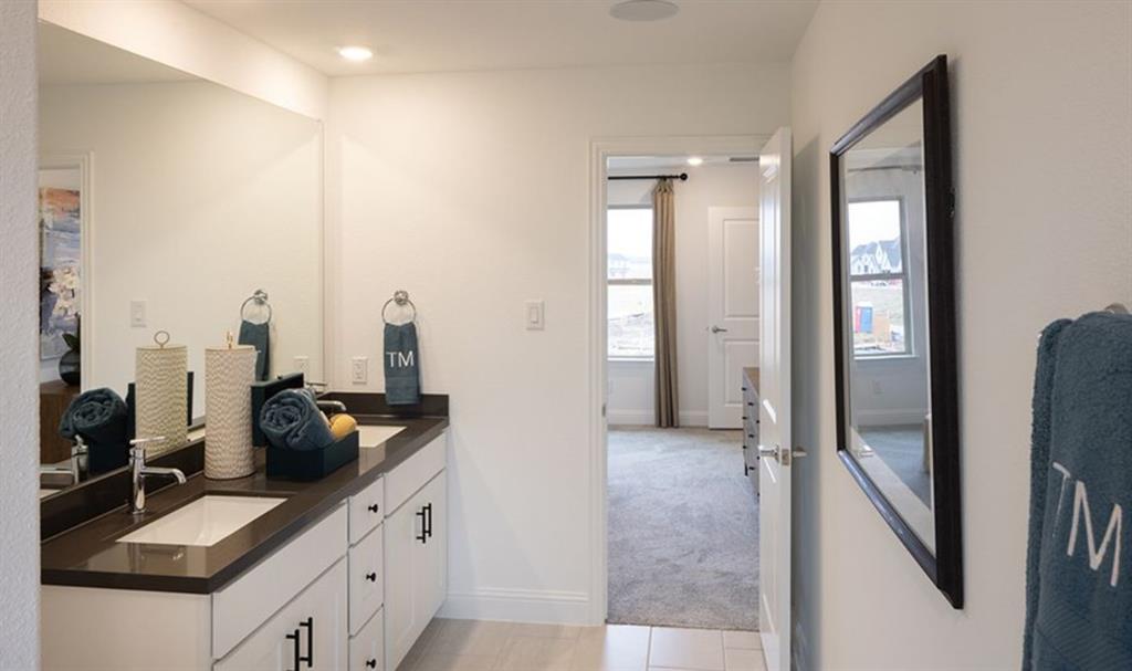 3116 Winecup Road Celina, TX 75009 - Photo 7 of 17 a kitchen with refrigerator and window