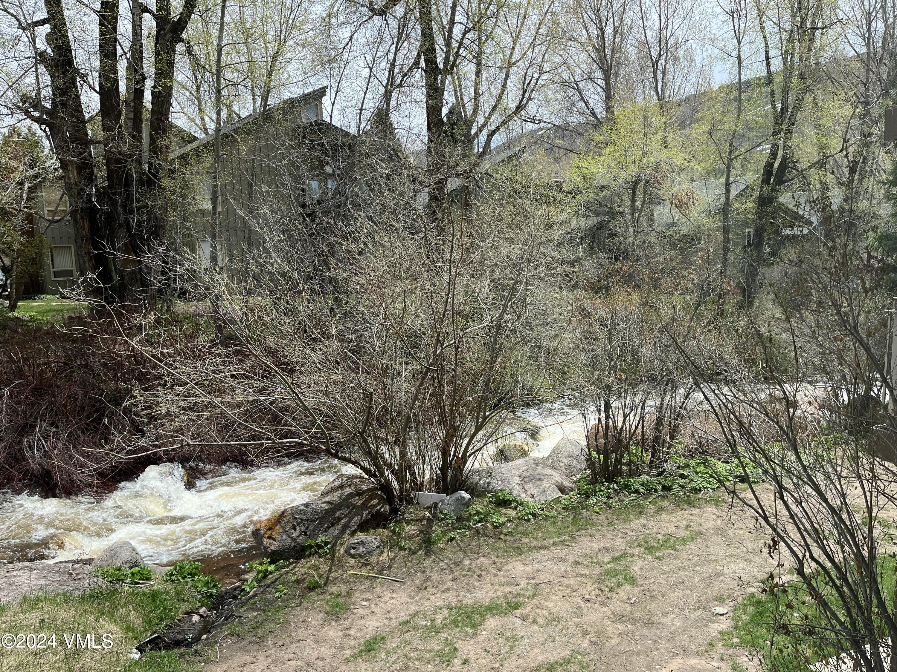 1020 Vail View Drive, Unit 320832 Vail, CO 81657 - Photo 4 of 12 a view of a yard covered with snow
