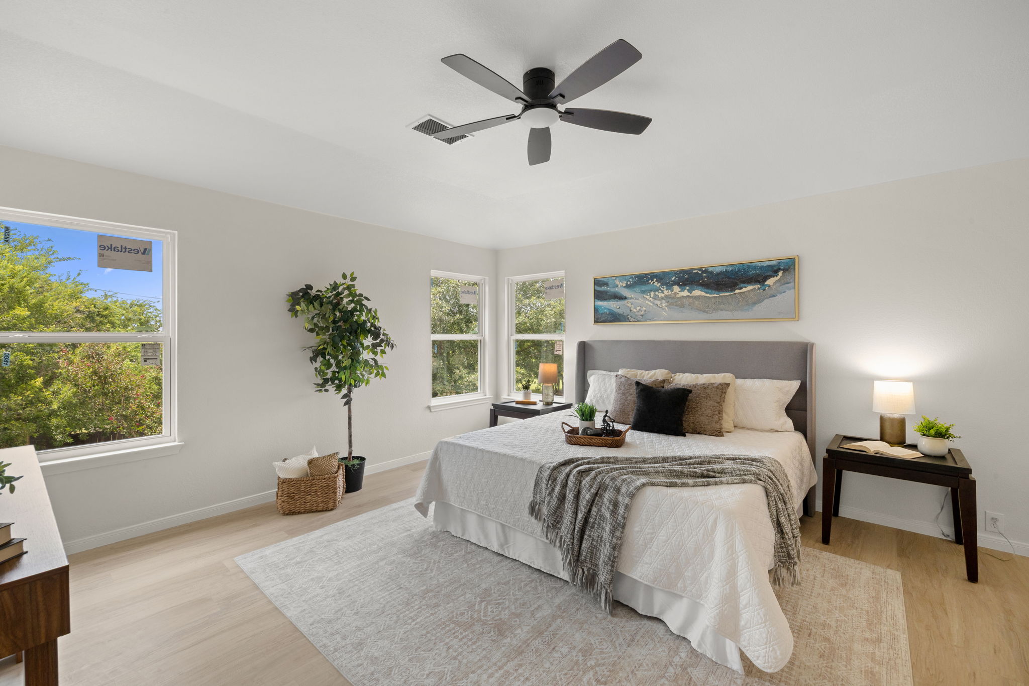 909 Rocking Spur Cove Pflugerville, TX 78660 - Photo 14 of 33 Relaxation awaits in this light-filled bedroom with serene views and a comforting ambiance.