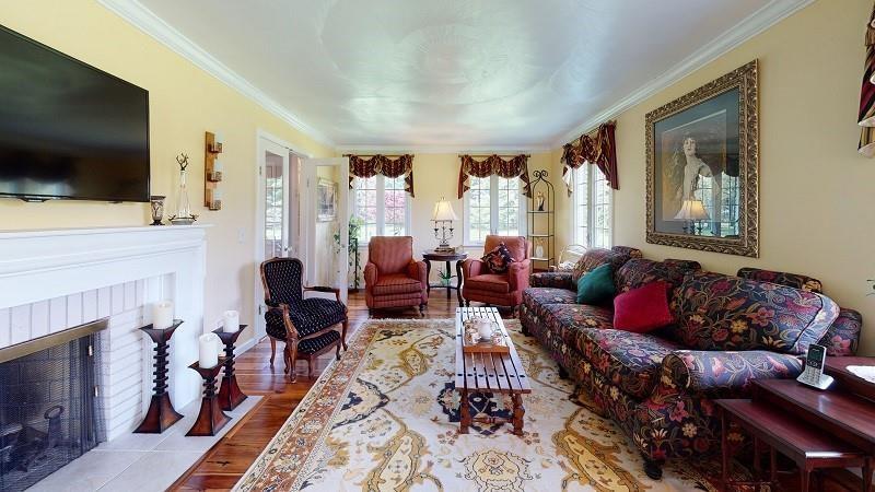 23982 Middle Road Cambridge Springs, PA 16403 - Photo 2 of 25 a living room with furniture fireplace and flat screen tv