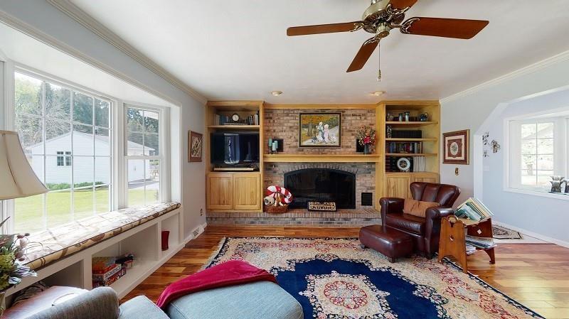 23982 Middle Road Cambridge Springs, PA 16403 - Photo 8 of 25 a living room with furniture and a fireplace