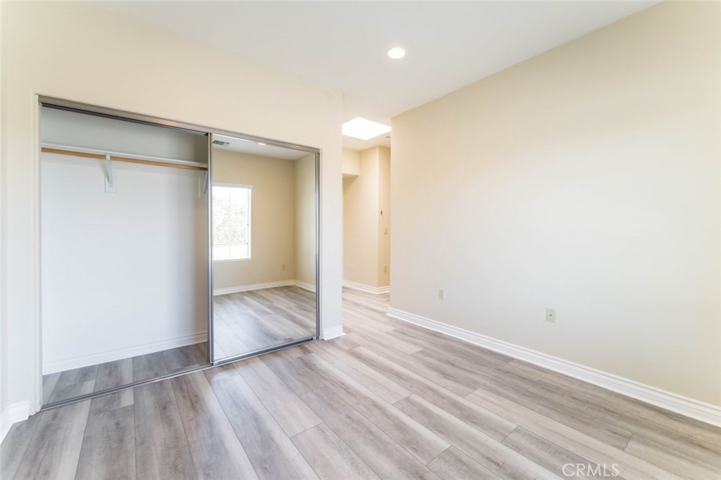 511 East Harvard Road, Unit 101 Burbank, CA 91501 - Photo 26 of 29 a view of hallway with wooden floor