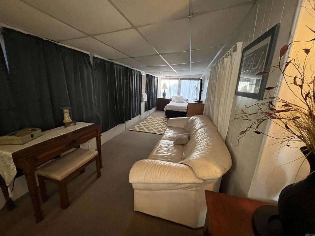 1810 Hillsdale Road, Unit 99 El Cajon, CA 92019 - Photo 9 of 15 a bed room with a bed and a window