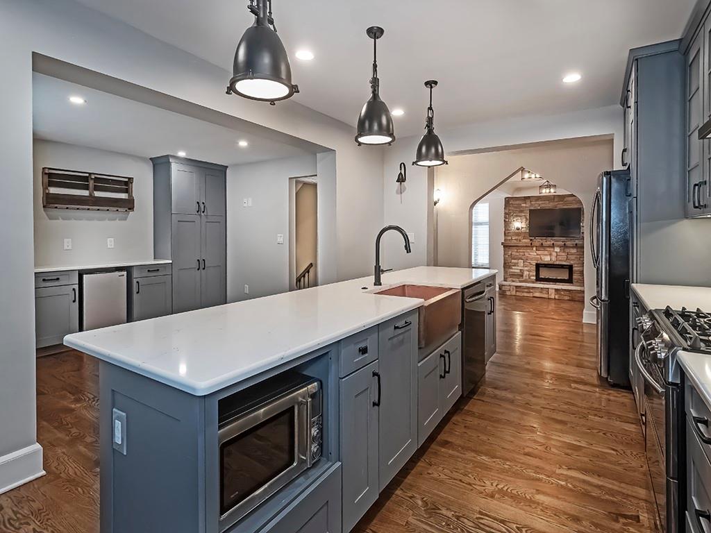 1035 Washington Road Pittsburgh, PA 15228 - Photo 14 of 44 a large kitchen with stainless steel appliances a large counter space a sink and cabinets