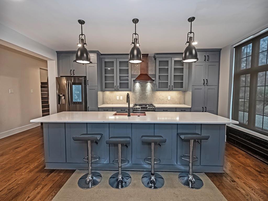 1035 Washington Road Pittsburgh, PA 15228 - Photo 15 of 44 a kitchen with a sink a window and chairs