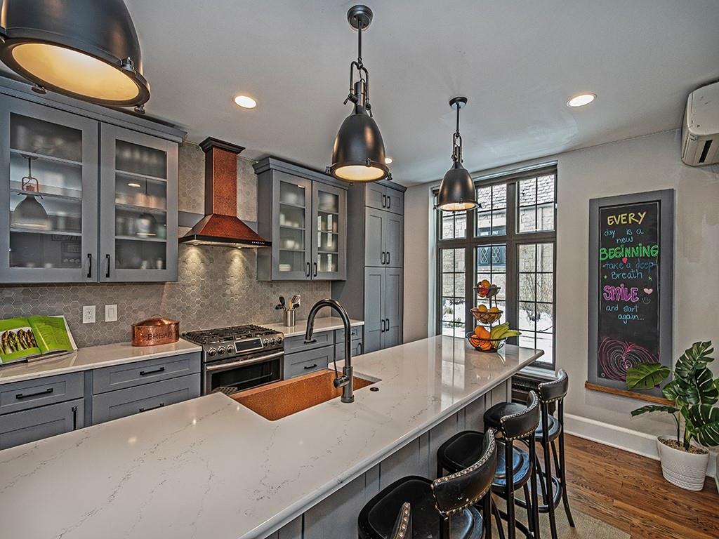 1035 Washington Road Pittsburgh, PA 15228 - Photo 17 of 44 a kitchen that has a table chairs and cabinets