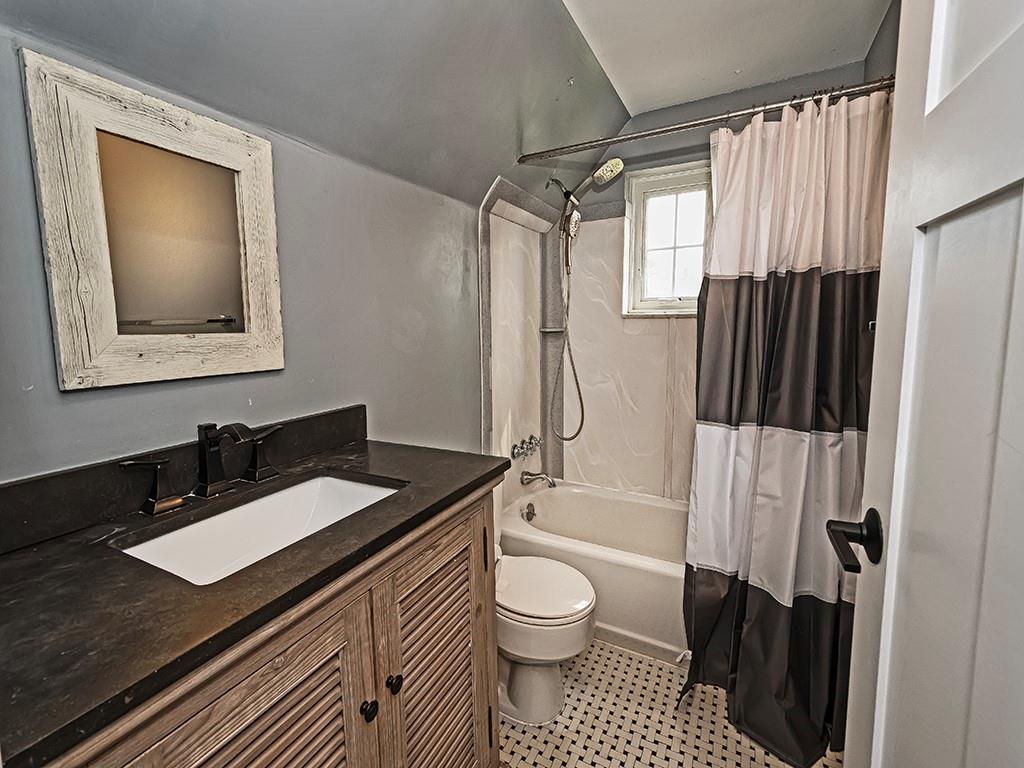 1035 Washington Road Pittsburgh, PA 15228 - Photo 33 of 44 a bathroom with a granite countertop sink toilet a shower and a mirror