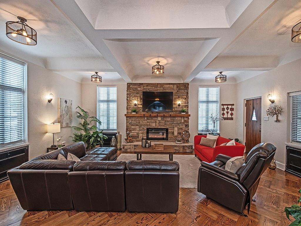 1035 Washington Road Pittsburgh, PA 15228 - Photo 4 of 44 a living room with furniture a fireplace and a flat screen tv