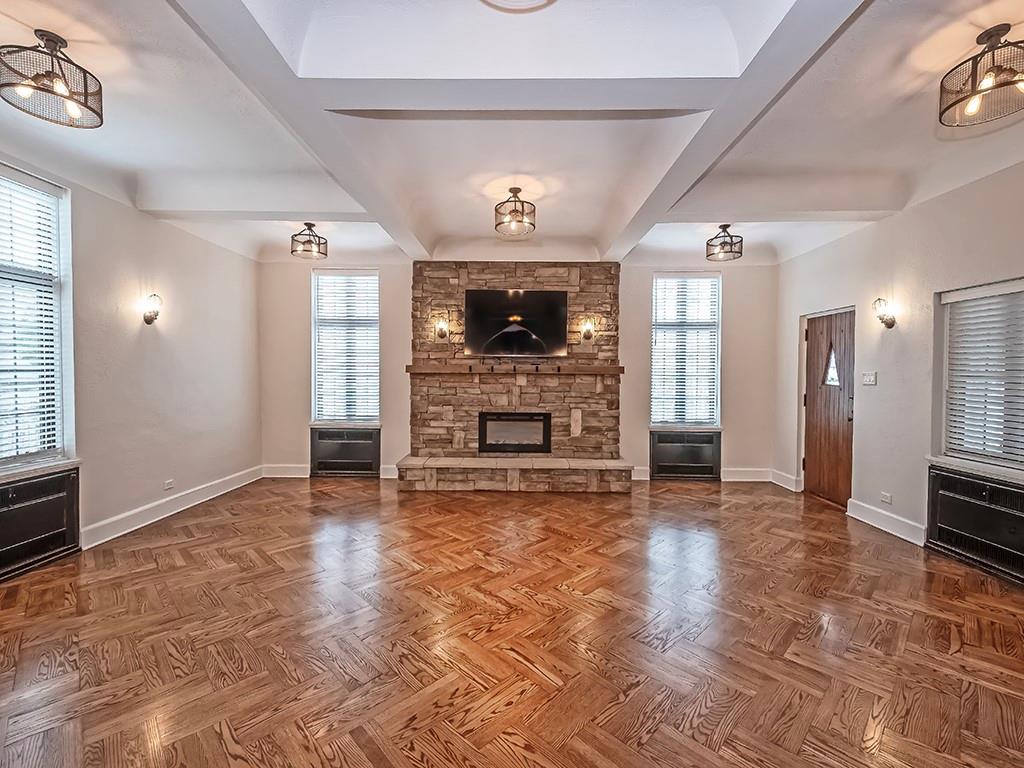 1035 Washington Road Pittsburgh, PA 15228 - Photo 6 of 44 a view of a livingroom with a fireplace a ceiling fan and windows