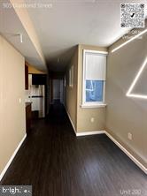 905 Diamond Street, Unit 200 Philadelphia, PA 19122 - Photo 8 of 8 a view of hallway with stairs and wooden floor