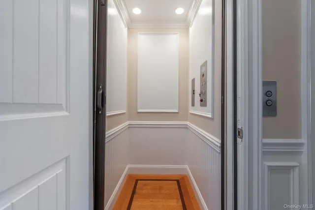 a view of a two chairs on the roof deck