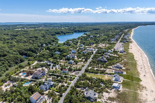 an aerial view of house with a yard