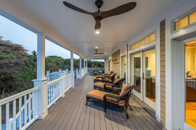 a view of a chairs and tables in patio of a house