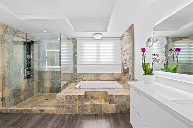 a spacious bedroom with a bed and a window